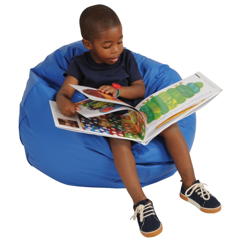 child reading in blue bean bag